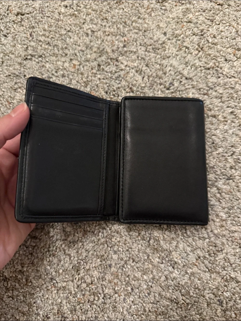 Tumi Black Leather Trifold Wallet with Red Fabric Trim